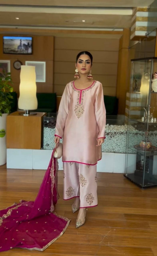 A Graceful Woman in a Pink Salwar Suit Captivating the Hotel Lobby Atmosphere