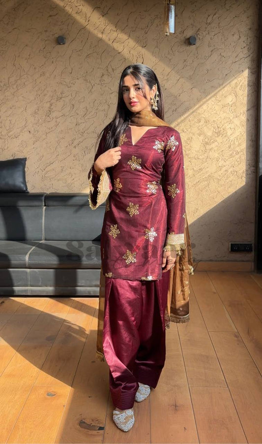 A Portrait of Grace in a Luxurious Maroon Ensemble